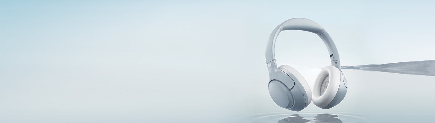 Auriculares blancos Over-Ear con diseño moderno sobre superficie brillante, fondo minimalista