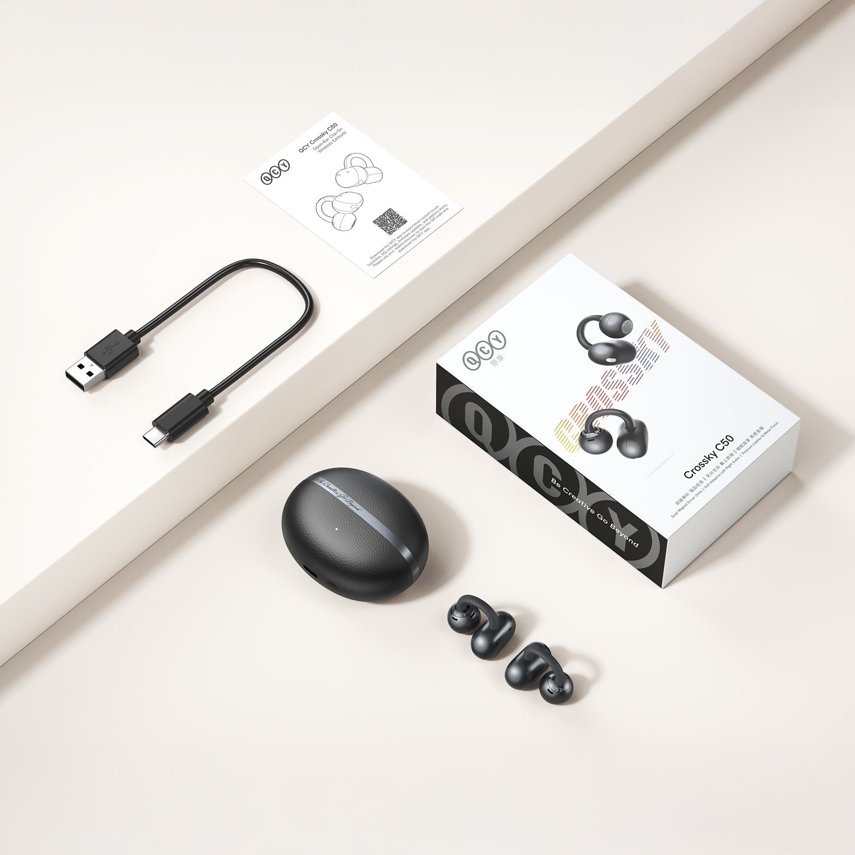 Auriculares inalámbricos verdaderos QCY Crossky C50 con estuche de carga, USB-C y manual.