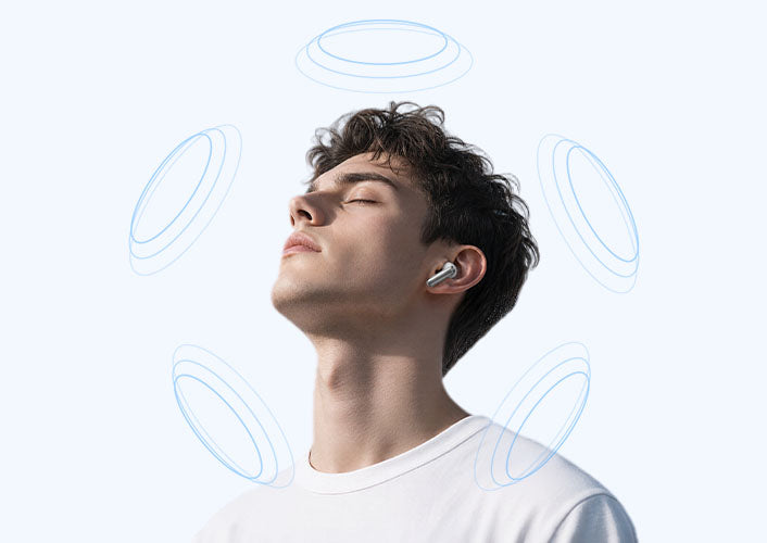 Joven con auriculares inalámbricos, experiencia relajante gracias a las ondas sonoras.