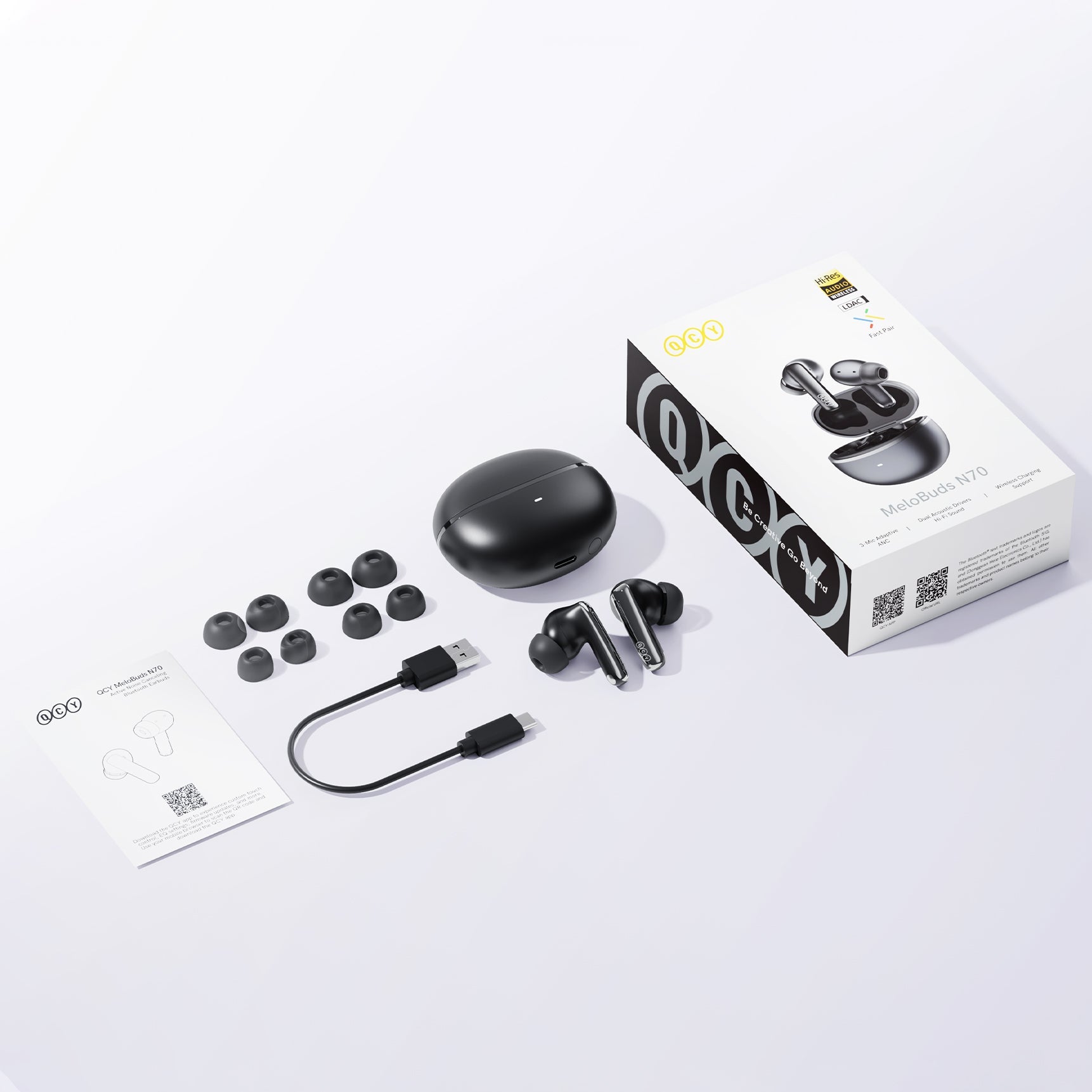 Auriculares inalámbricos verdaderos QCY MeloBuds N70 con estuche de carga, almohadillas de repuesto y cable USB-C.