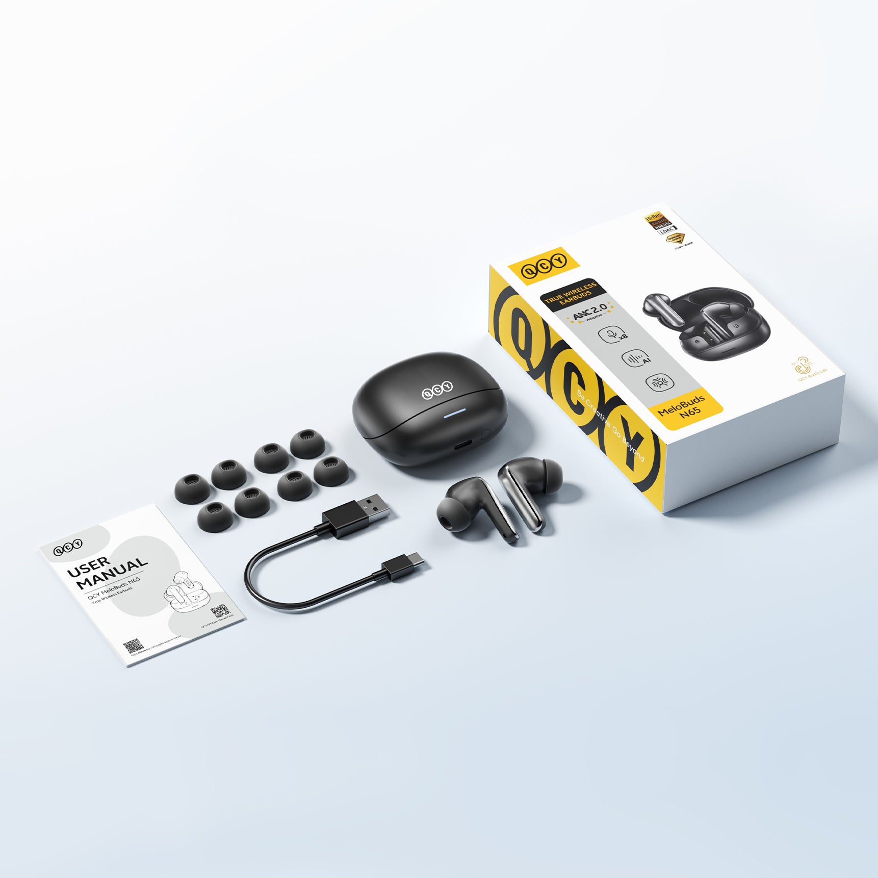 Auriculares inalámbricos verdaderos QCY MeloBuds N65 con ANC, cable de carga USB-C y almohadillas de repuesto.